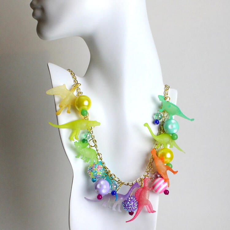 A Rainbow of Phosphorescent Dinosaurs Necklace